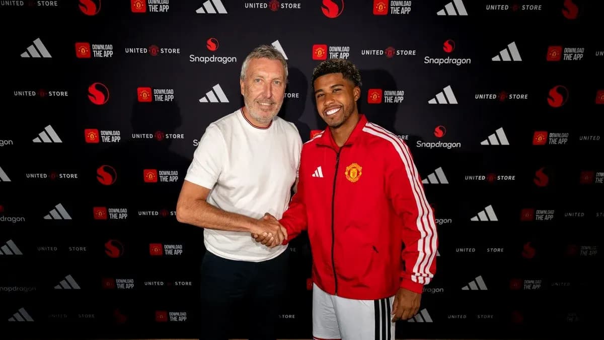 Player and representative shaking hands at signing event Player and representative shaking hands at signing event