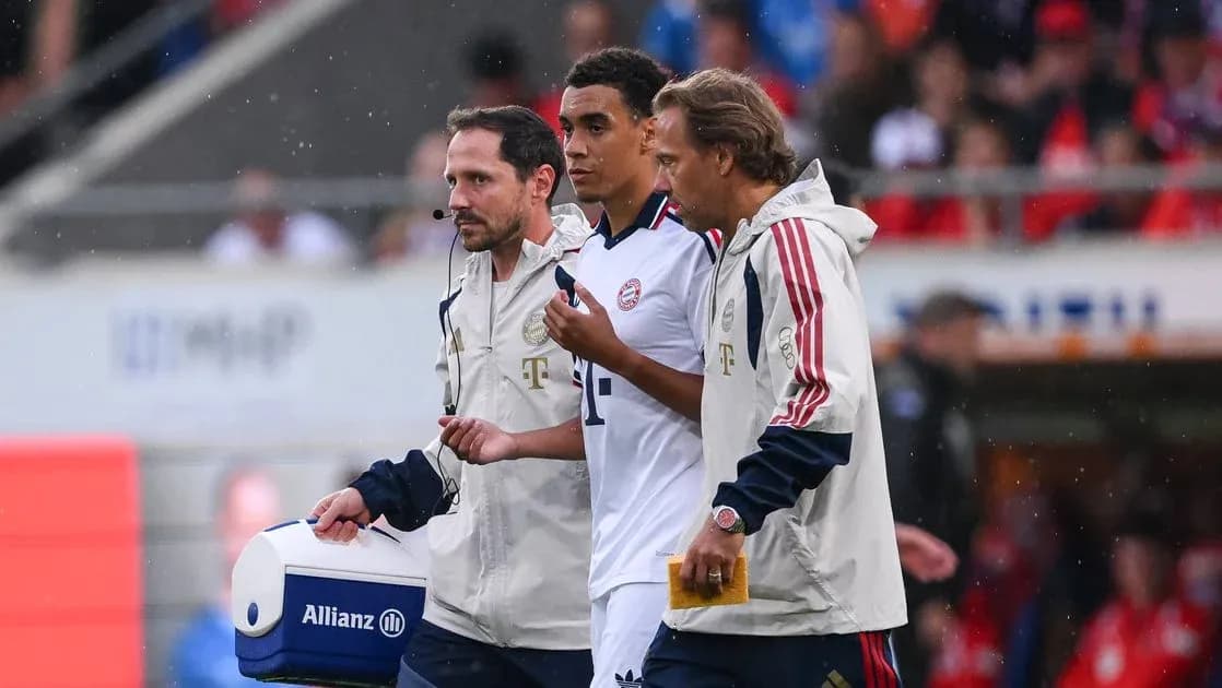 Player being assisted by staff during match Player being assisted by staff during match
