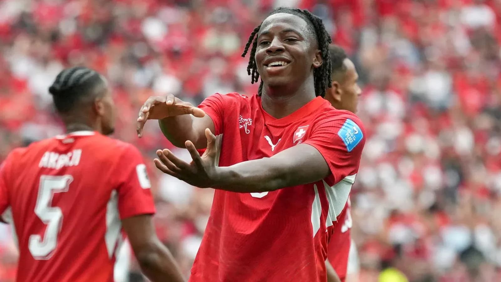 Player celebrating with teammates during a match Player celebrating with teammates during a match