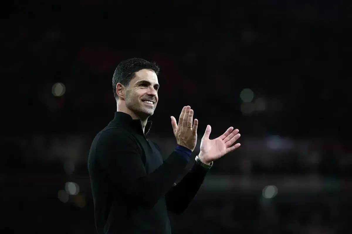 Manager applauding fans after match conclusion Manager applauding fans after match conclusion