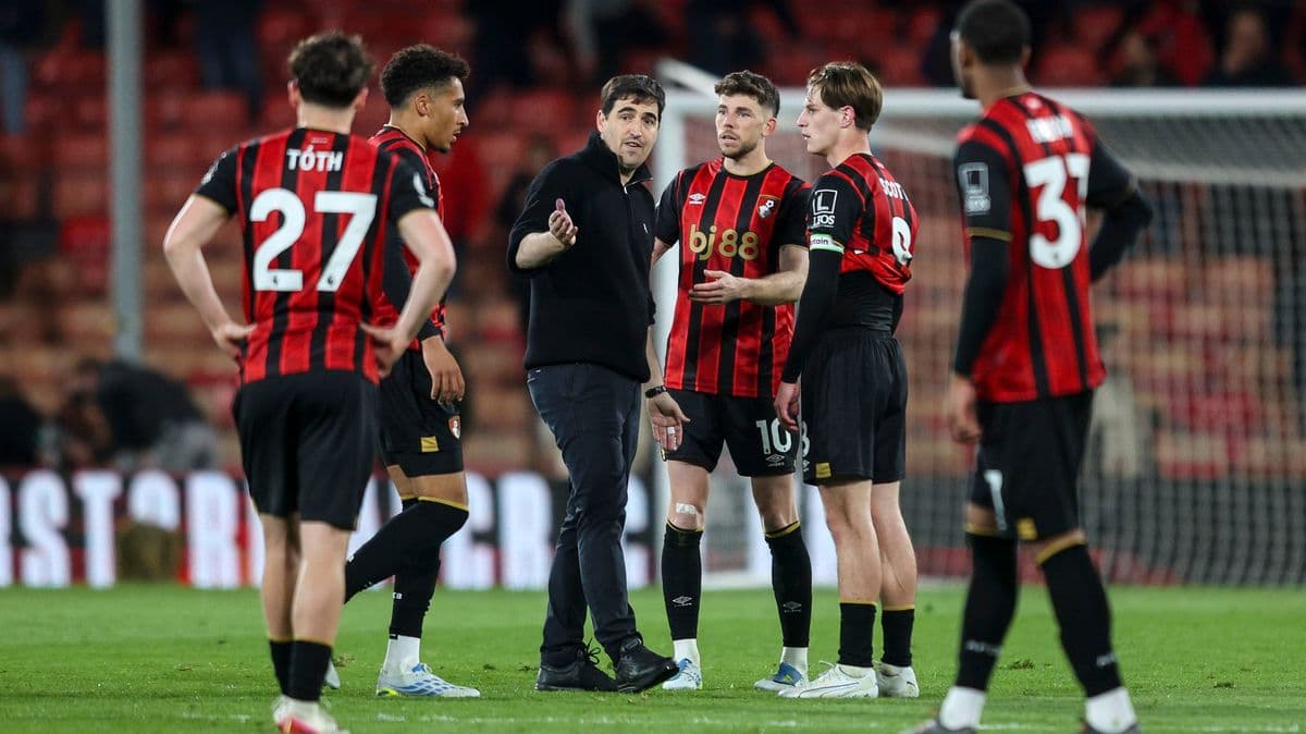 Bournemouth players discussing strategy with coach Bournemouth players discussing strategy with coach