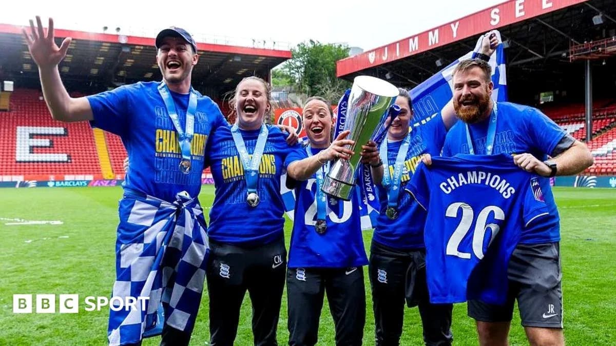 Birmingham City players celebrating with trophy and medals Birmingham City players celebrating with trophy and medals