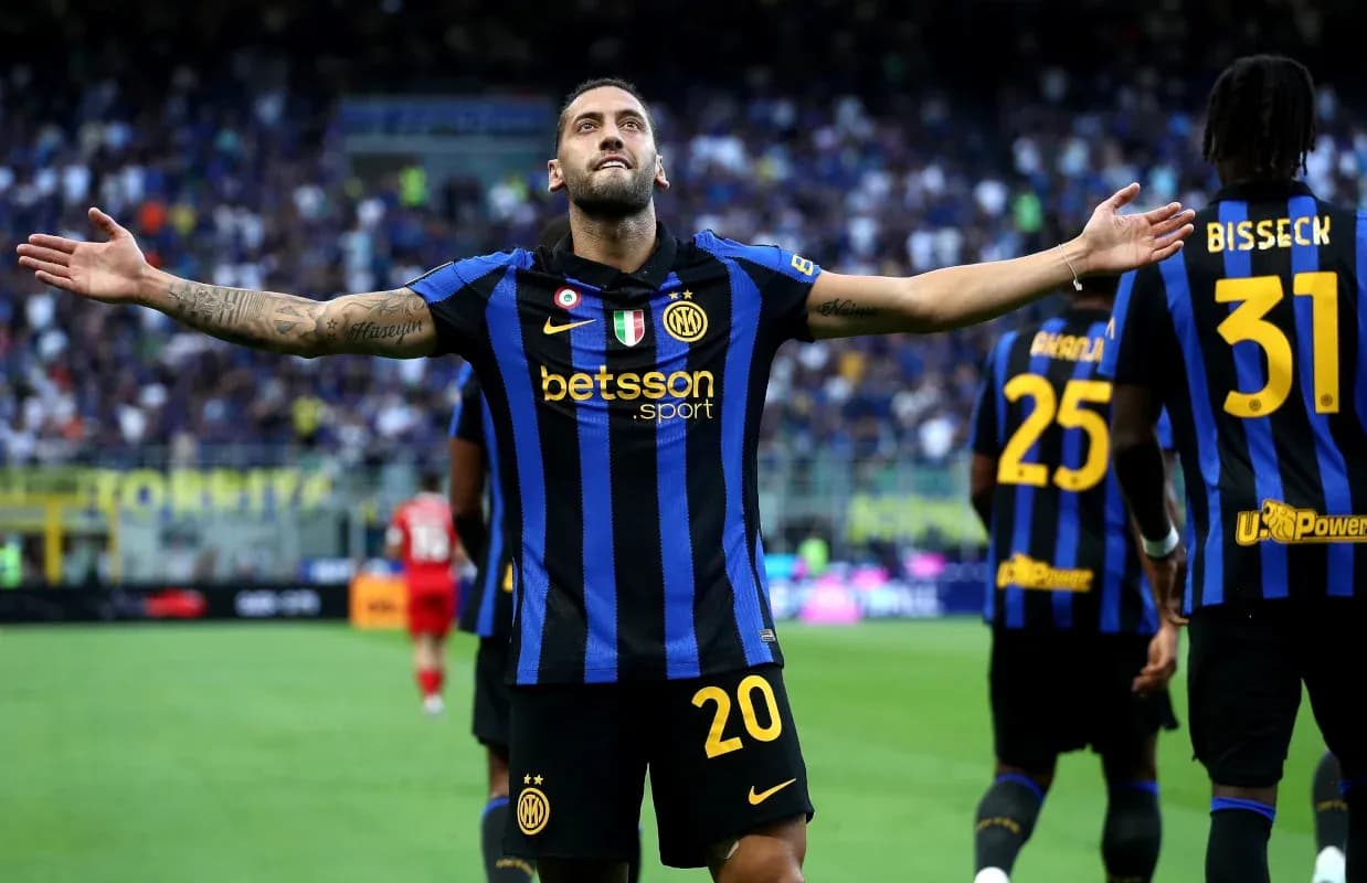 Player celebrating a goal with teammates in stadium Player celebrating a goal with teammates in stadium