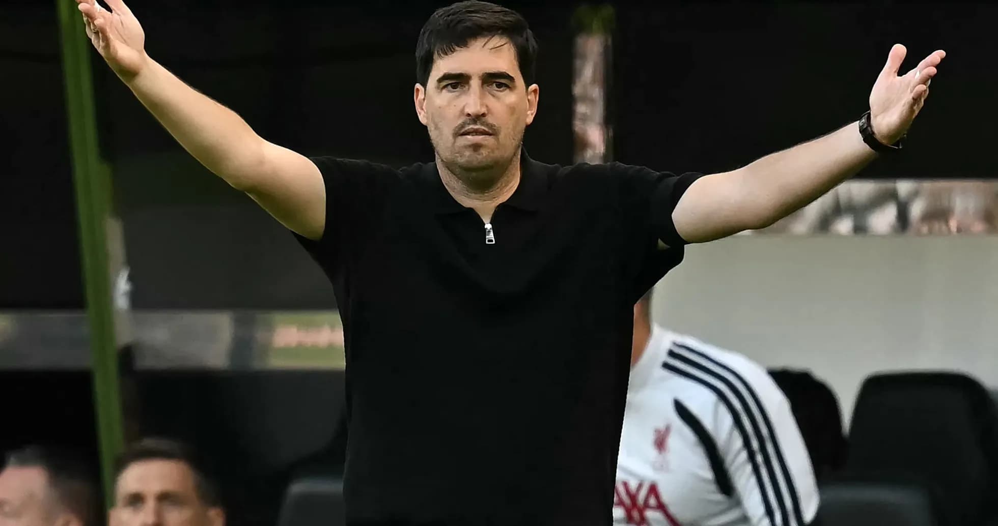Coach gesturing during a football match on sidelines Coach gesturing during a football match on sidelines