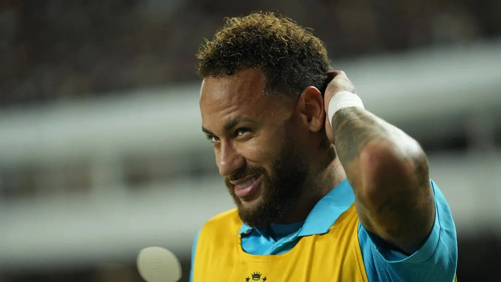 Neymar adjusting his hair during a match Neymar adjusting his hair during a match