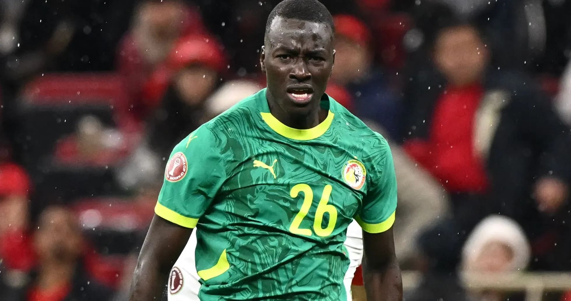 Player wearing green jersey during soccer match Player wearing green jersey during soccer match