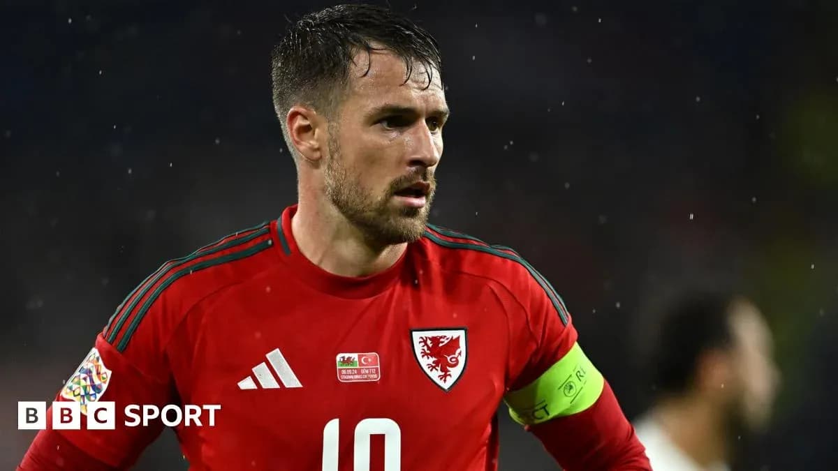 Wales player wearing red kit during match Wales player wearing red kit during match
