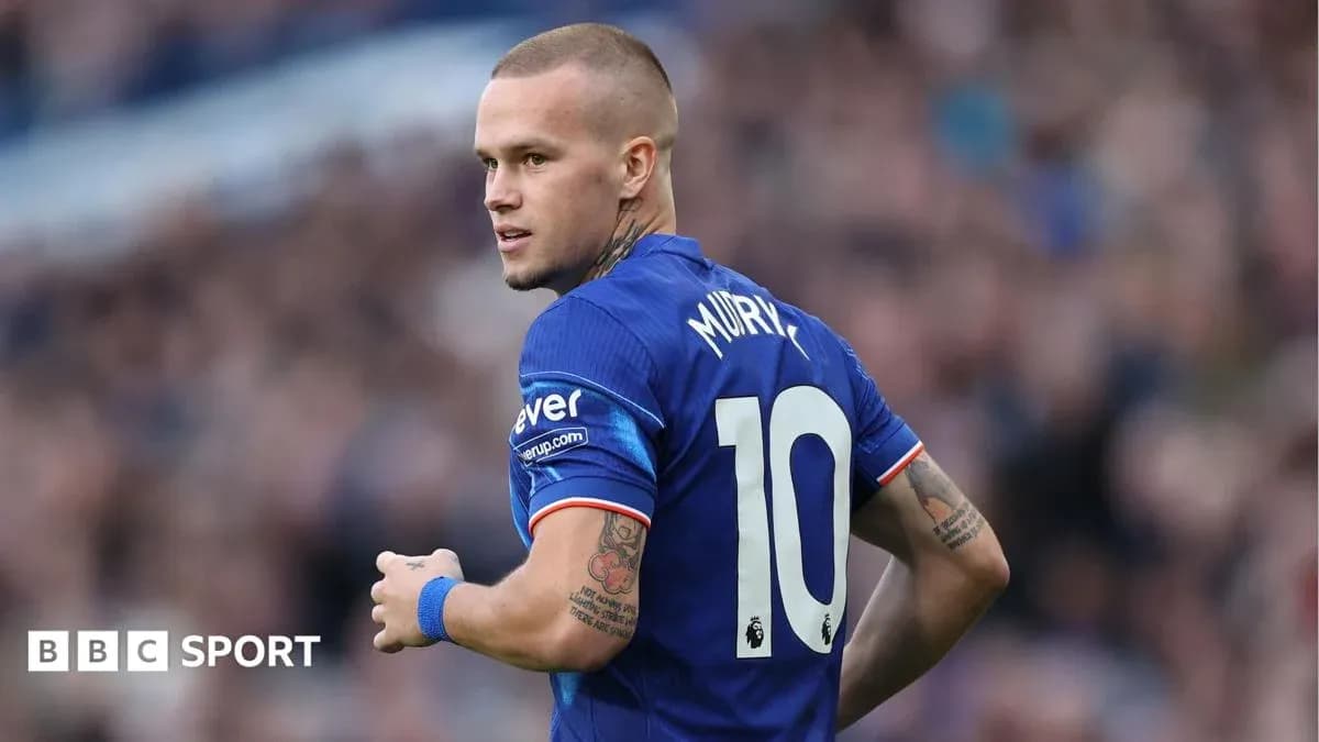 Player in blue jersey looking back during match Player in blue jersey looking back during match