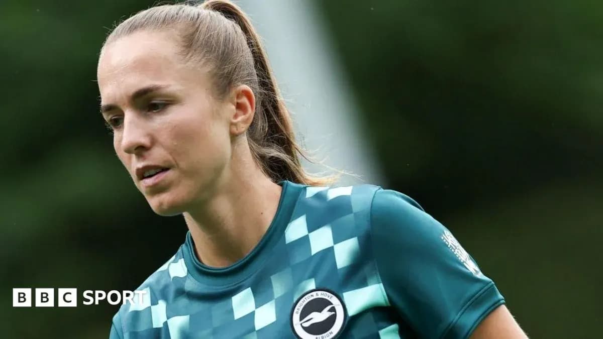 Female player in goalkeeper kit during training session Female player in goalkeeper kit during training session