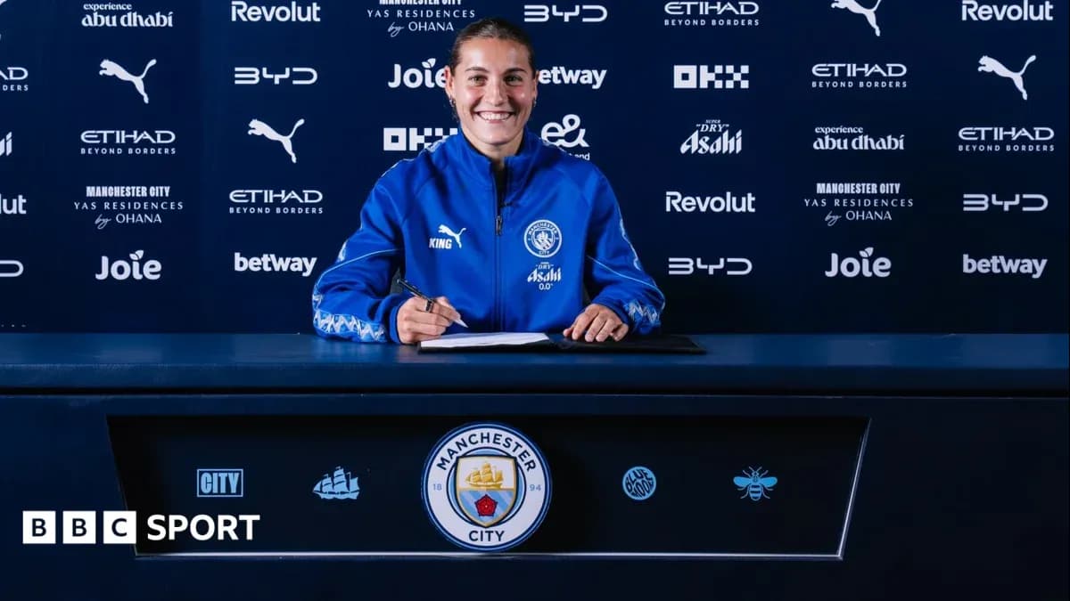 Player signing contract at Manchester City press event Player signing contract at Manchester City press event
