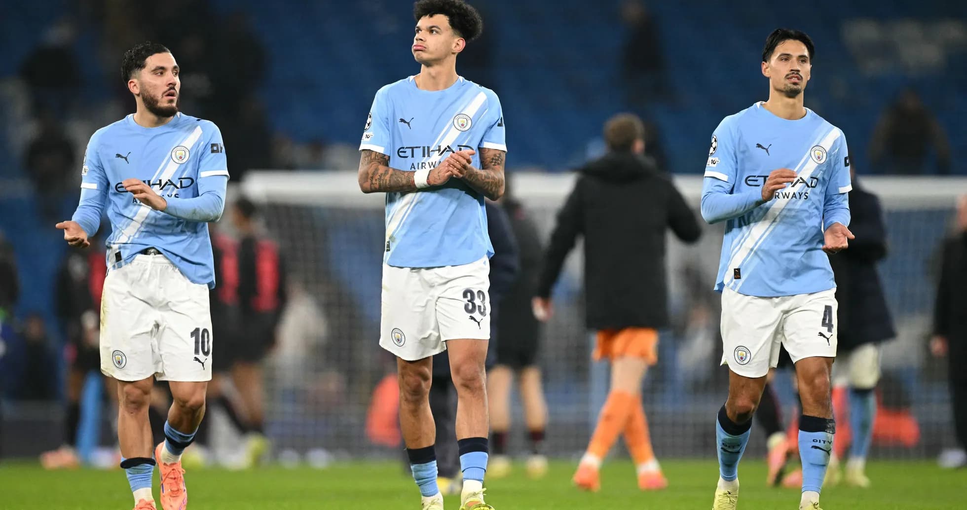Three Manchester City players leaving the pitch Three Manchester City players leaving the pitch