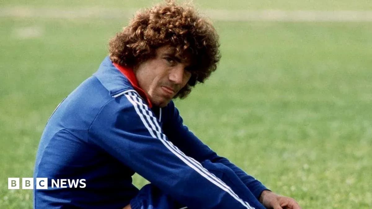 Player sitting on grass field in training outfit Player sitting on grass field in training outfit