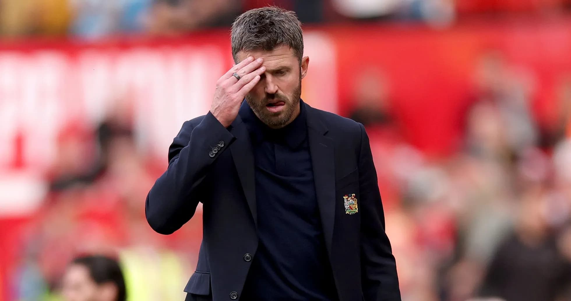 Manager walking on pitch during match with concern Manager walking on pitch during match with concern