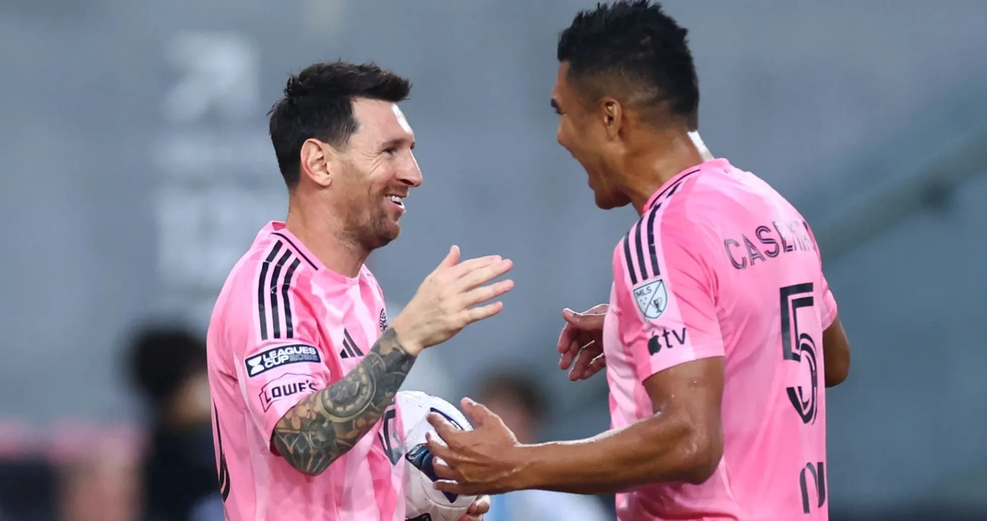 Players celebrating during a soccer match Players celebrating during a soccer match