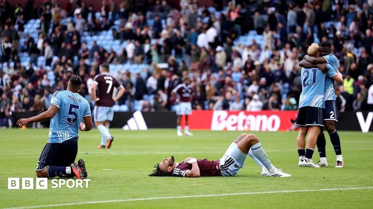 Players reacting after match; one on ground Players reacting after match; one on ground