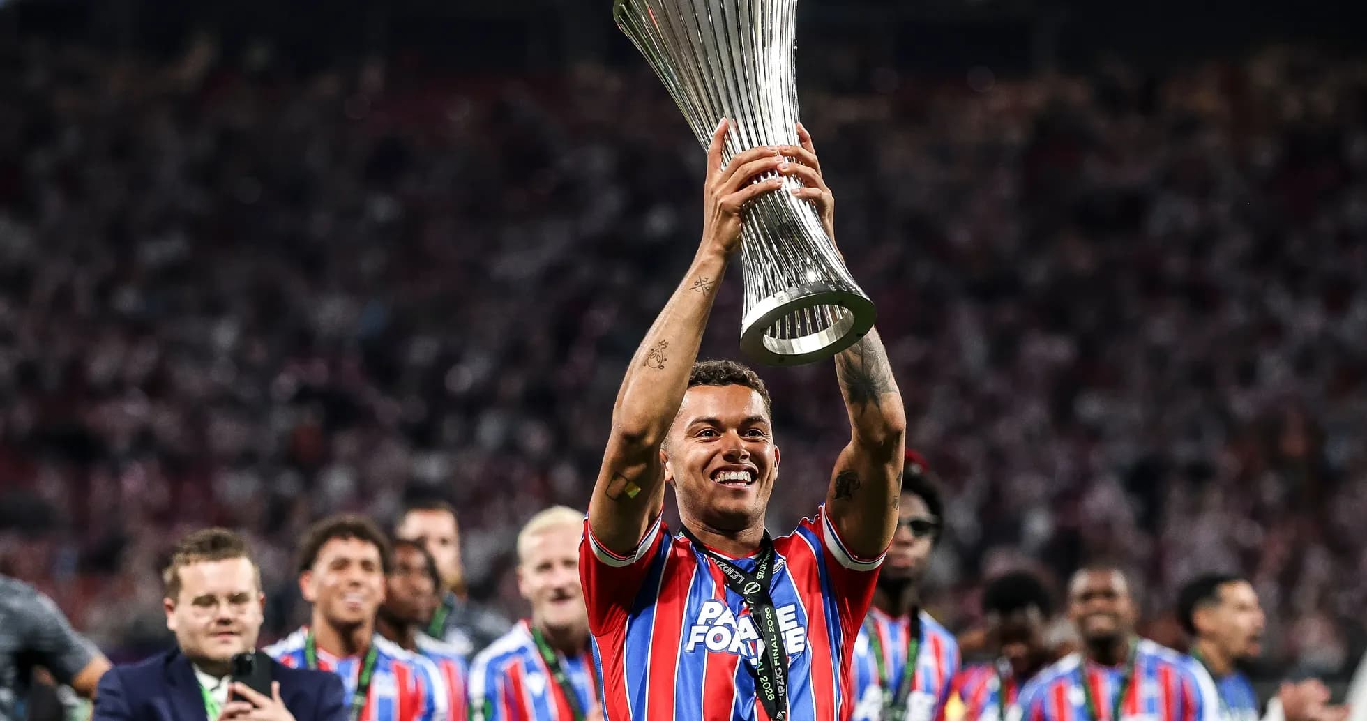 Player celebrating with trophy after winning final Player celebrating with trophy after winning final