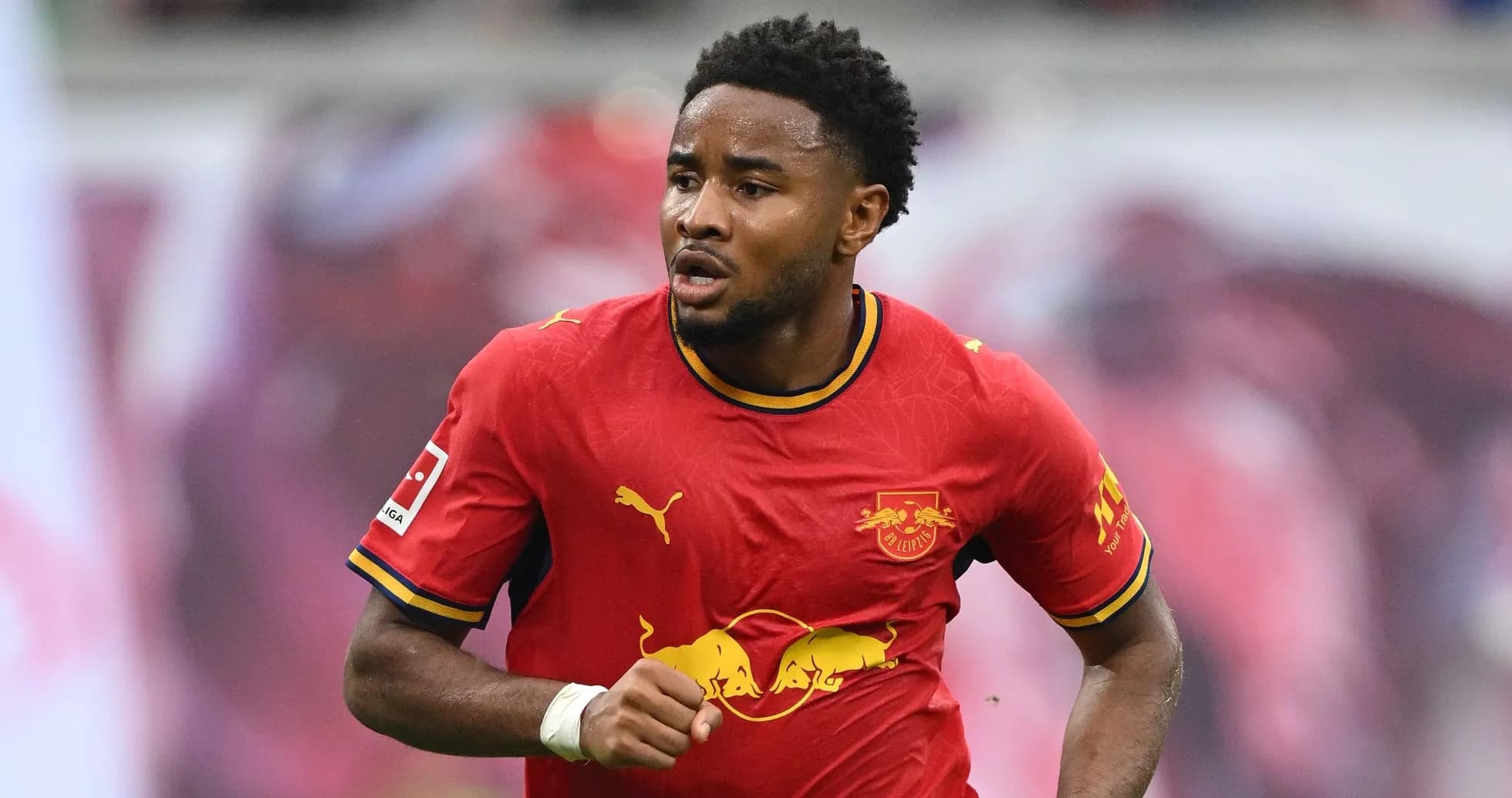 Player running in RB Leipzig red jersey during match Player running in RB Leipzig red jersey during match