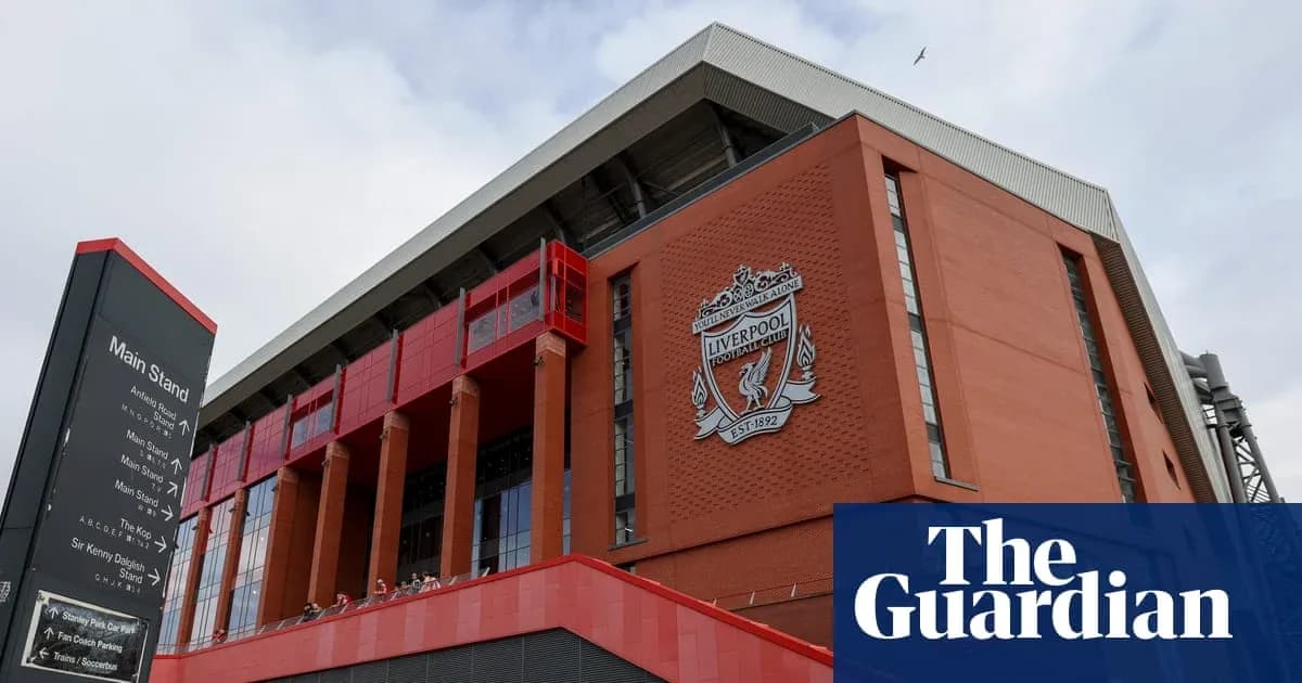 Exterior view of Anfield stadium with Liverpool FC logo Exterior view of Anfield stadium with Liverpool FC logo