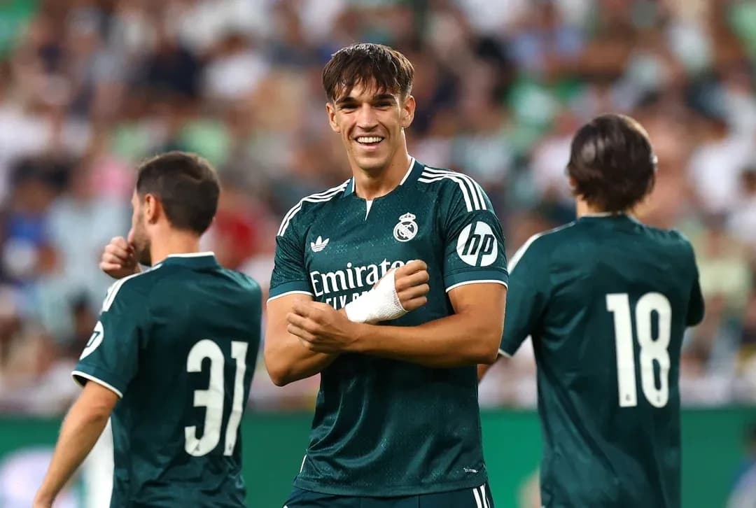 Real Madrid players celebrating on the field Real Madrid players celebrating on the field