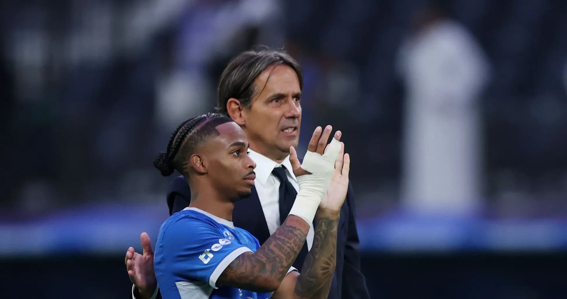 Player and coach interacting after the match Player and coach interacting after the match