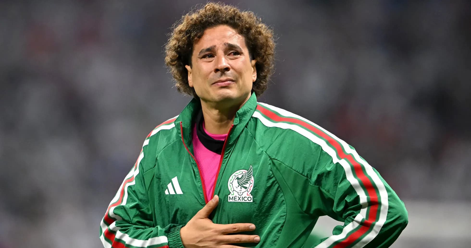 Goalkeeper in Mexico jacket on the field Goalkeeper in Mexico jacket on the field