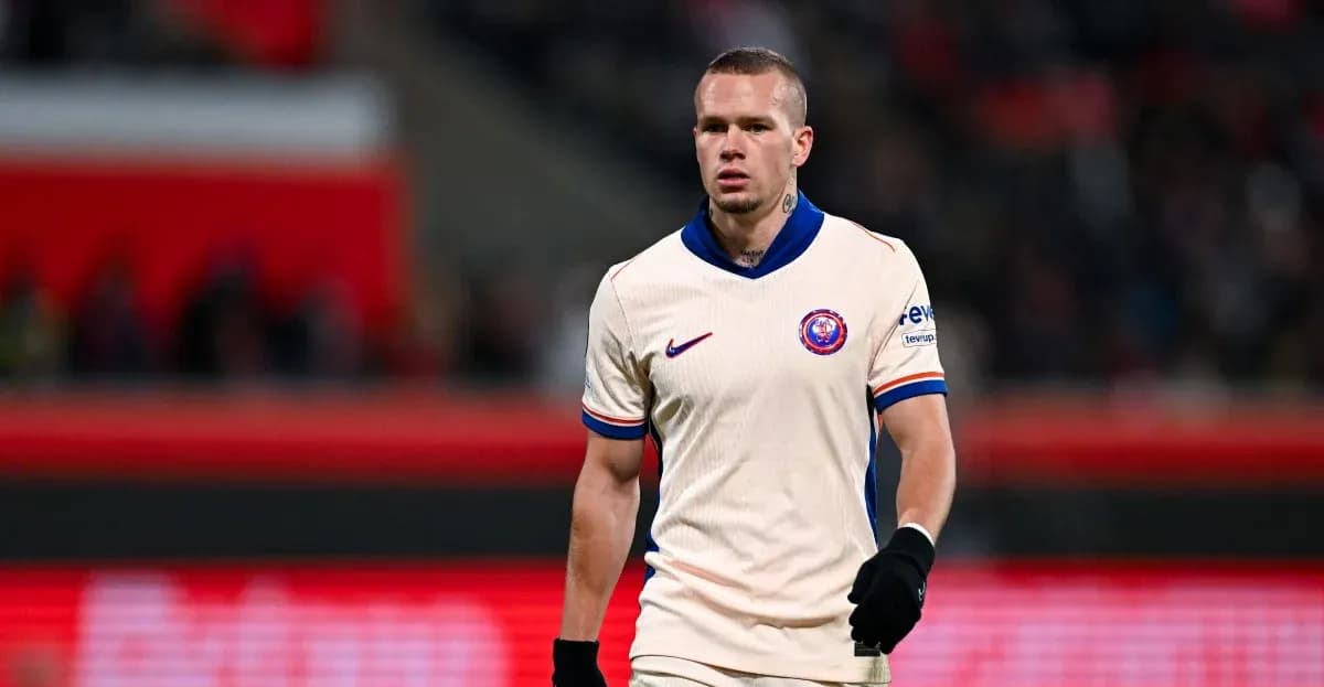 Player walking on the pitch during a match Player walking on the pitch during a match
