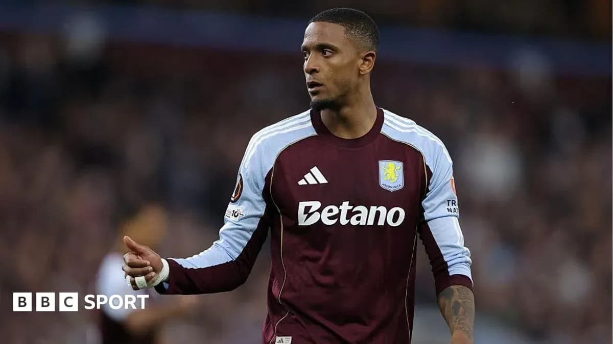 Player in Aston Villa kit gesturing during match Player in Aston Villa kit gesturing during match