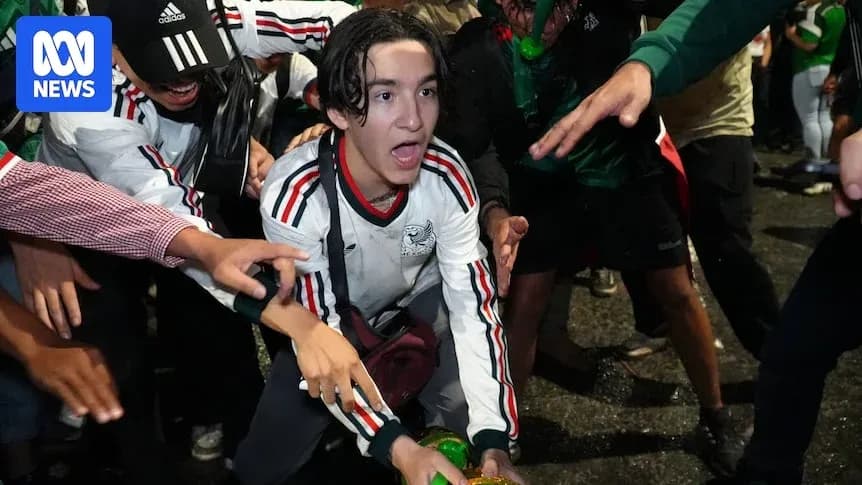 Fans celebrating with a soccer jersey during event Fans celebrating with a soccer jersey during event