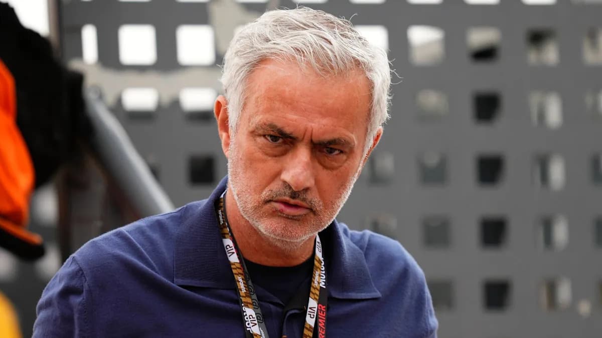 Coach in a blue shirt with a serious expression Coach in a blue shirt with a serious expression