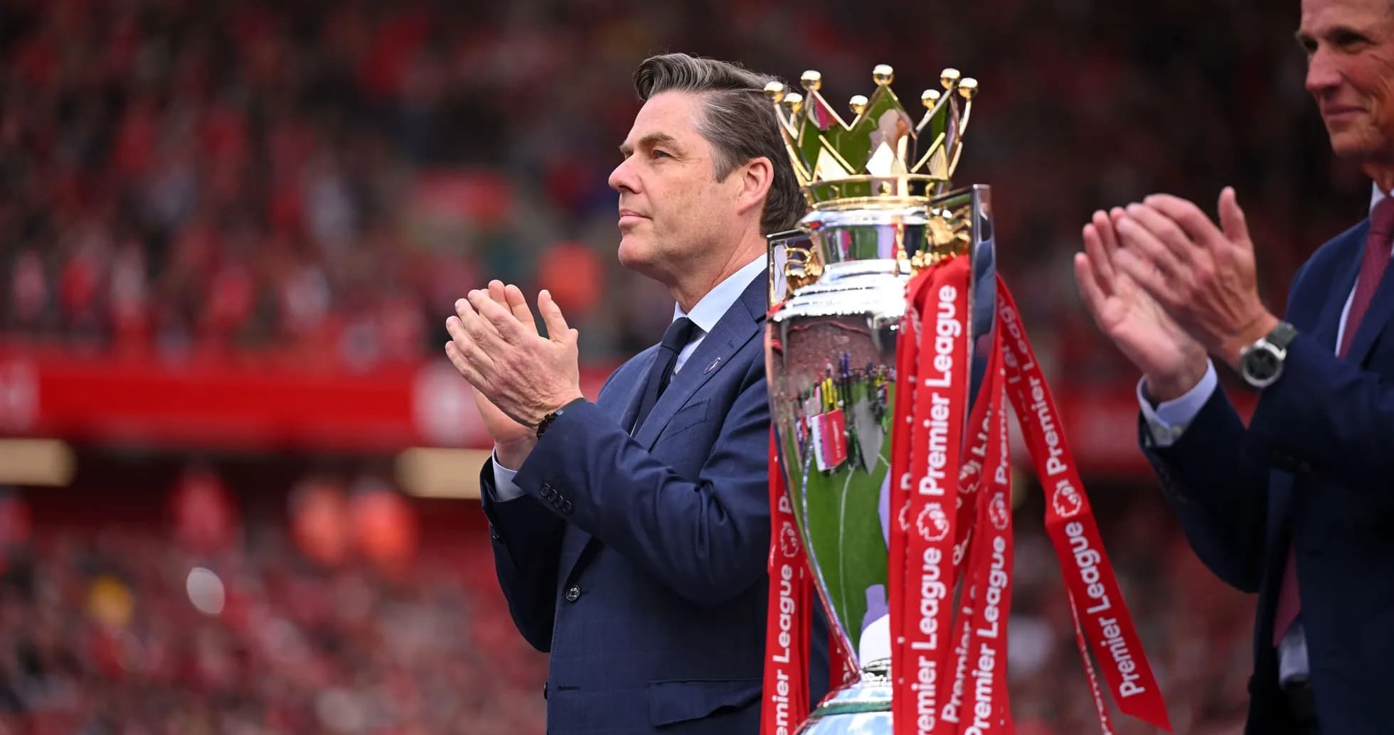 Official presenting Premier League trophy at ceremony Official presenting Premier League trophy at ceremony