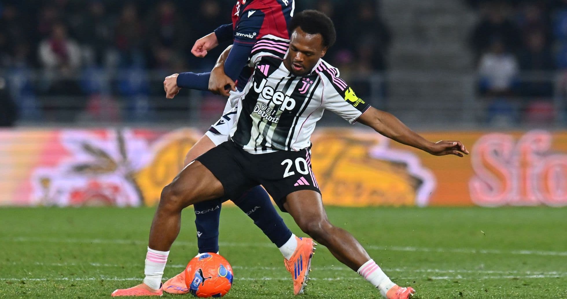 Juventus player tackling opponent during match Juventus player tackling opponent during match