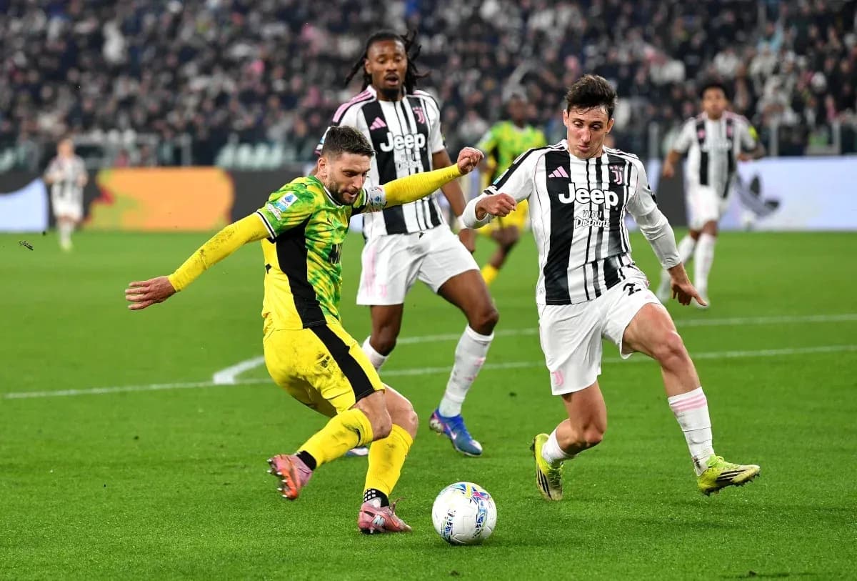 Juventus players contesting the ball during match Juventus players contesting the ball during match