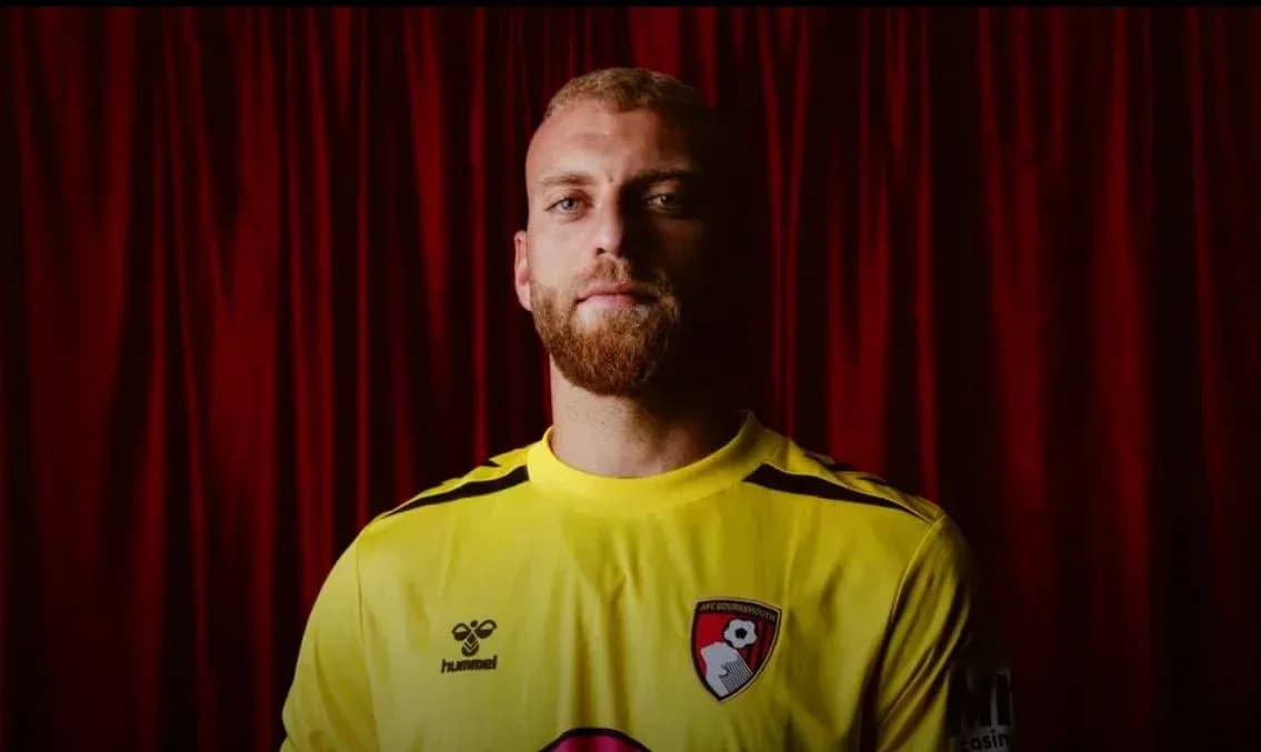 Goalkeeper in yellow jersey with AFC Bournemouth logo Goalkeeper in yellow jersey with AFC Bournemouth logo