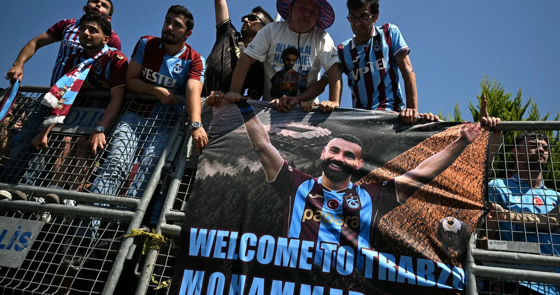 Fans holding a welcome banner for Mohammed in Trabzon Fans holding a welcome banner for Mohammed in Trabzon