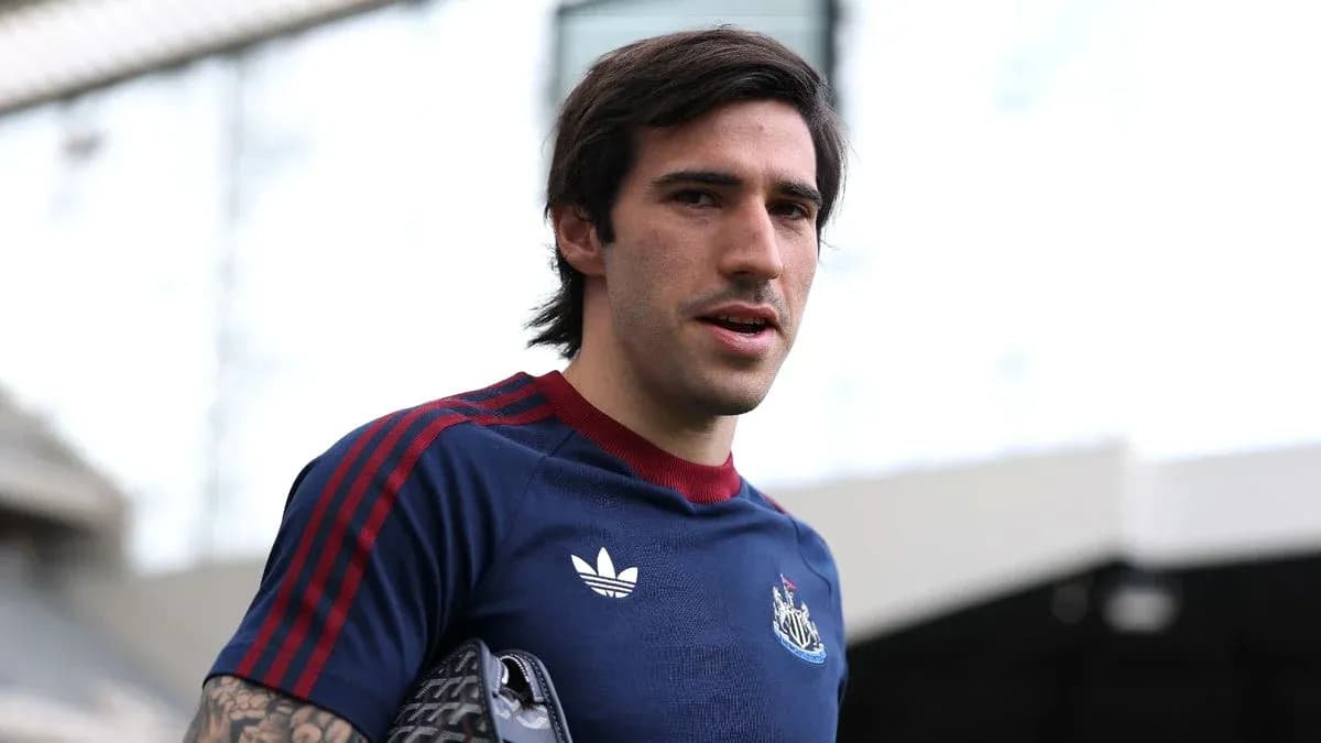 Football player in Newcastle training kit at stadium Football player in Newcastle training kit at stadium