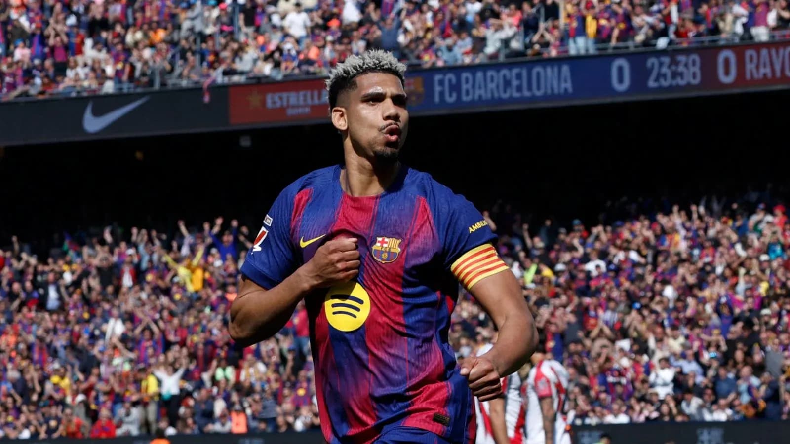 Player celebrating goal with fans in stadium Player celebrating goal with fans in stadium
