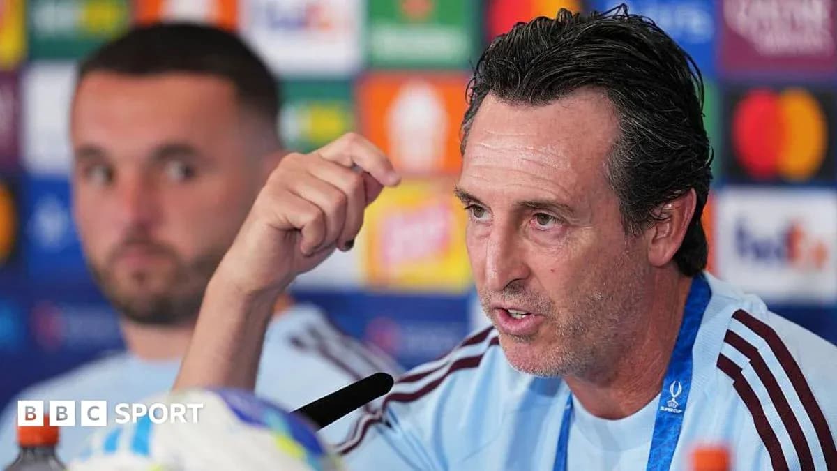 Manager speaking at press conference with player behind Manager speaking at press conference with player behind