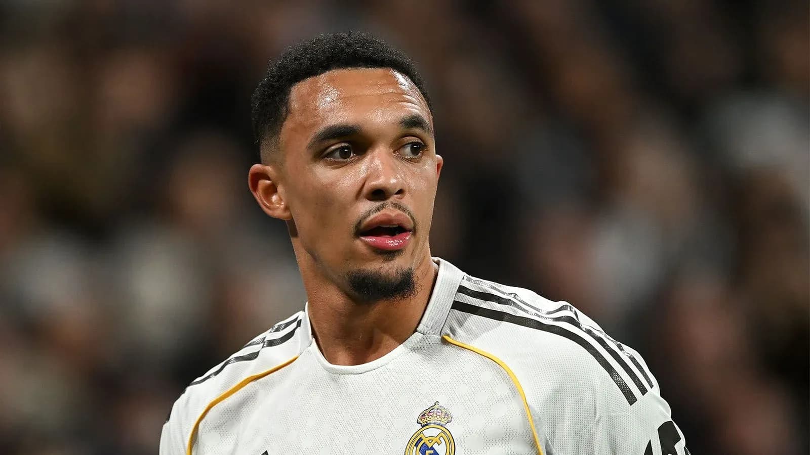 Football player in Real Madrid jersey during match Football player in Real Madrid jersey during match