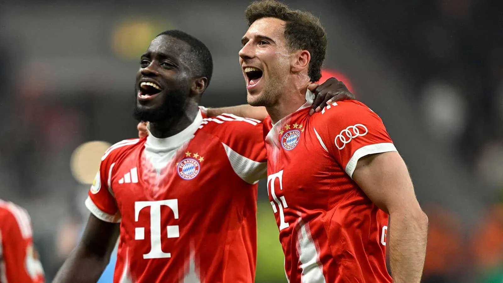 Two Bayern Munich players celebrating after a match Two Bayern Munich players celebrating after a match