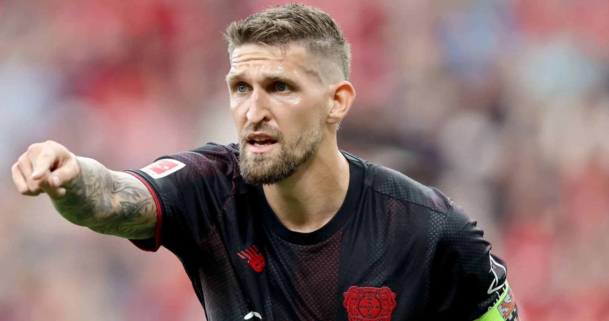 Player pointing during a football match Player pointing during a football match