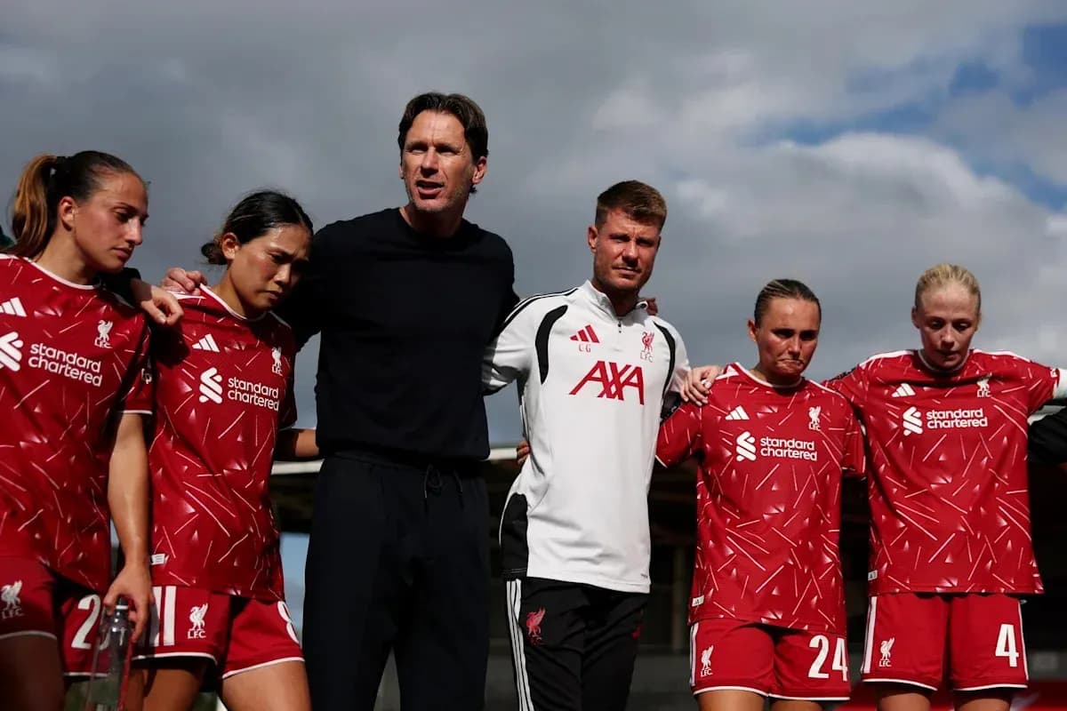 Liverpool Women's team huddled with coaching staff Liverpool Women's team huddled with coaching staff