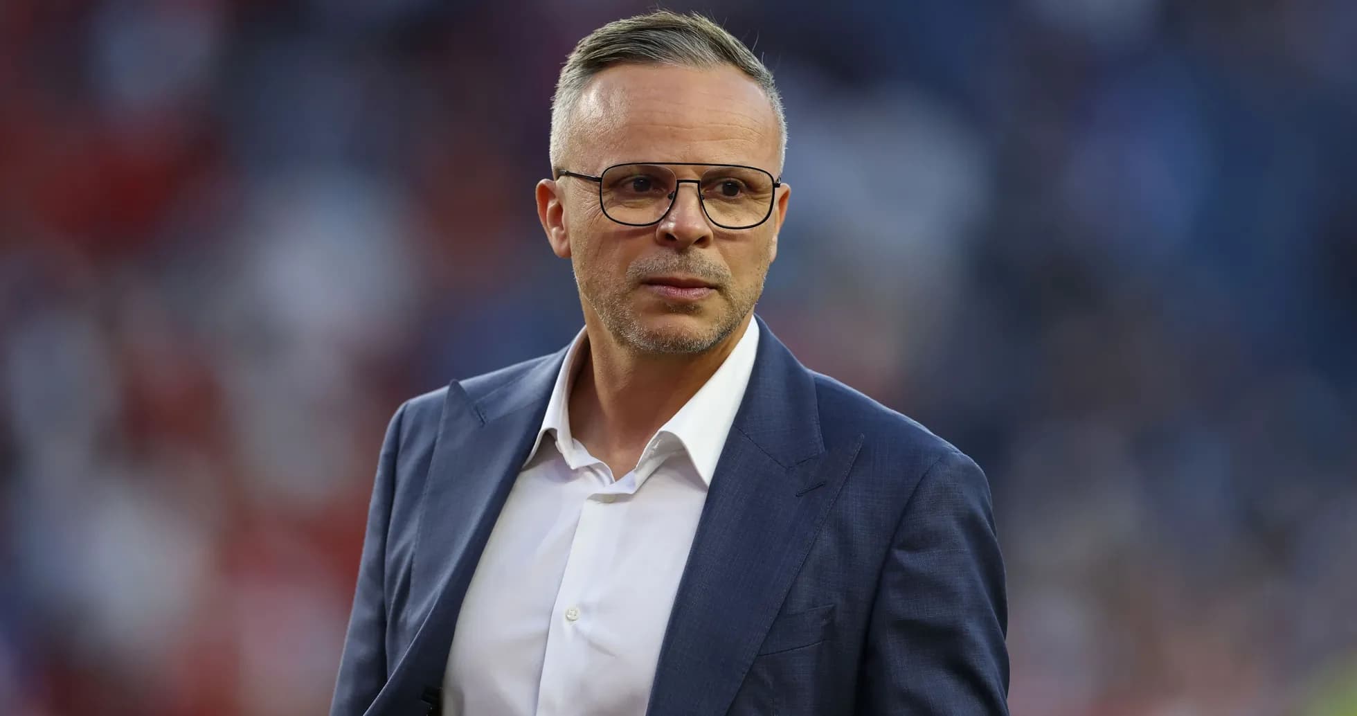 Coach in suit on the sidelines during match Coach in suit on the sidelines during match