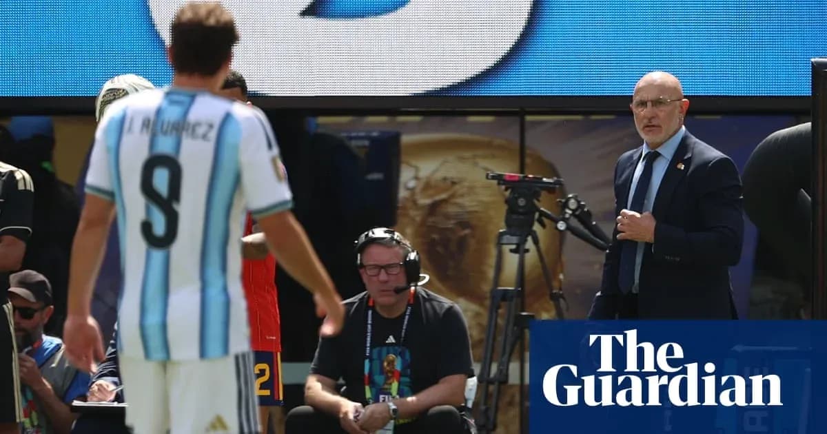 Argentina player leaving field with coach observing Argentina player leaving field with coach observing