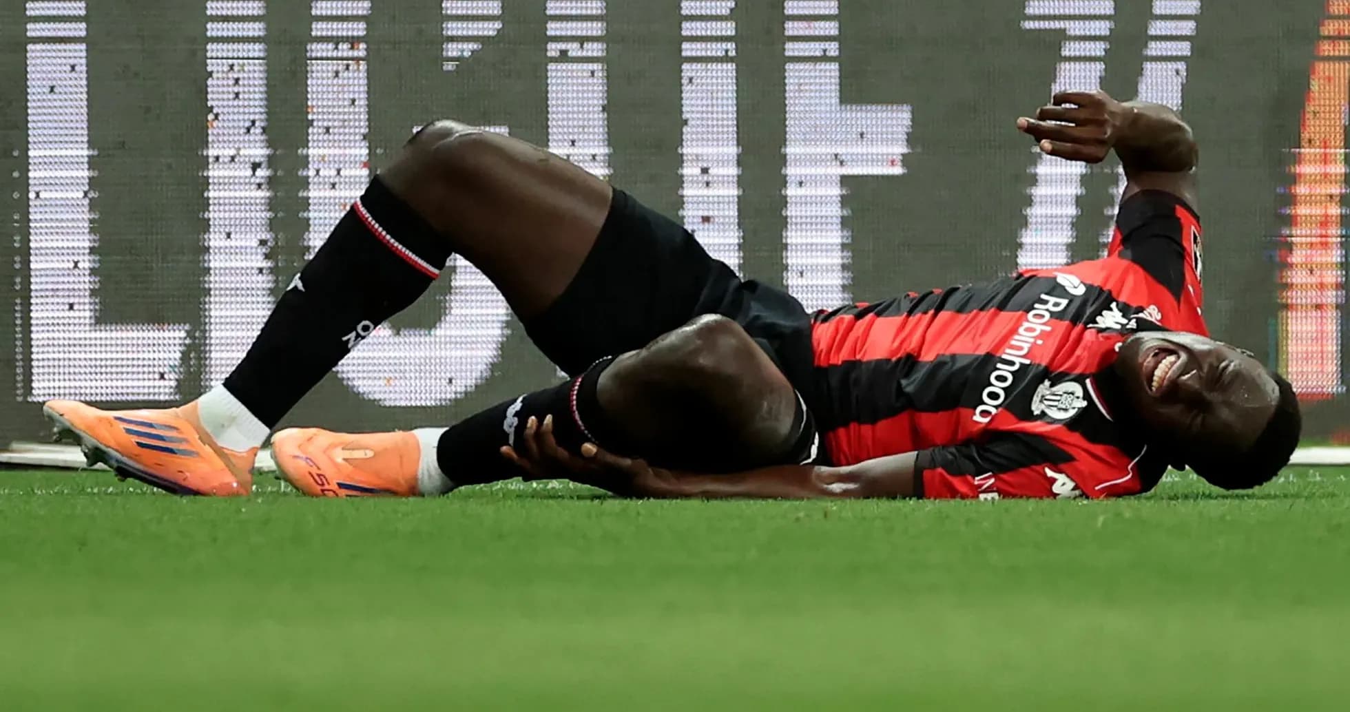 Player lying on ground in pain during match Player lying on ground in pain during match