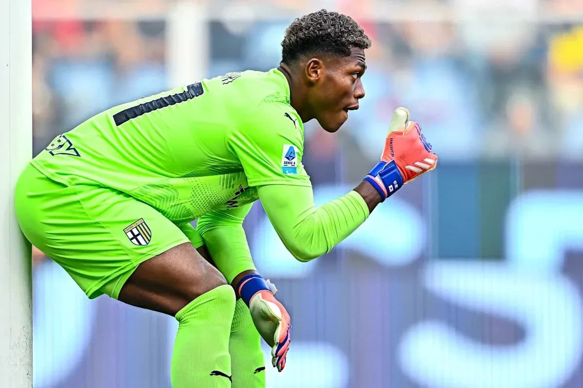 Goalkeeper in green uniform signaling during match Goalkeeper in green uniform signaling during match