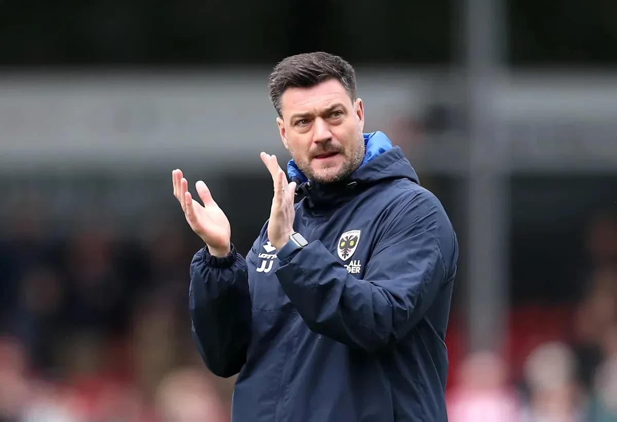 Manager clapping on the sidelines during match Manager clapping on the sidelines during match