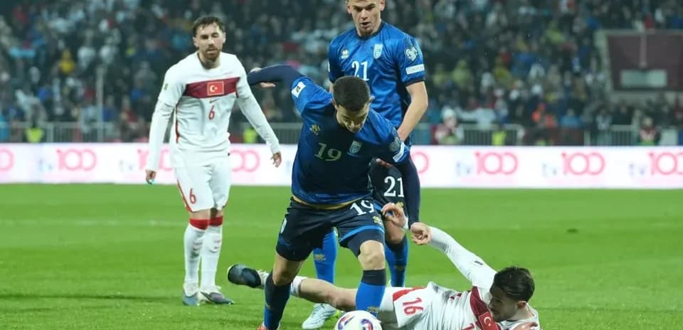 Player falling while competing for the ball during match Player falling while competing for the ball during match