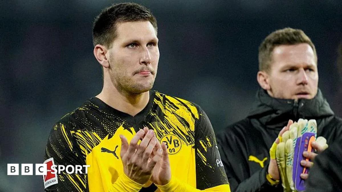 Goalkeeper applauding fans after match with teammate Goalkeeper applauding fans after match with teammate