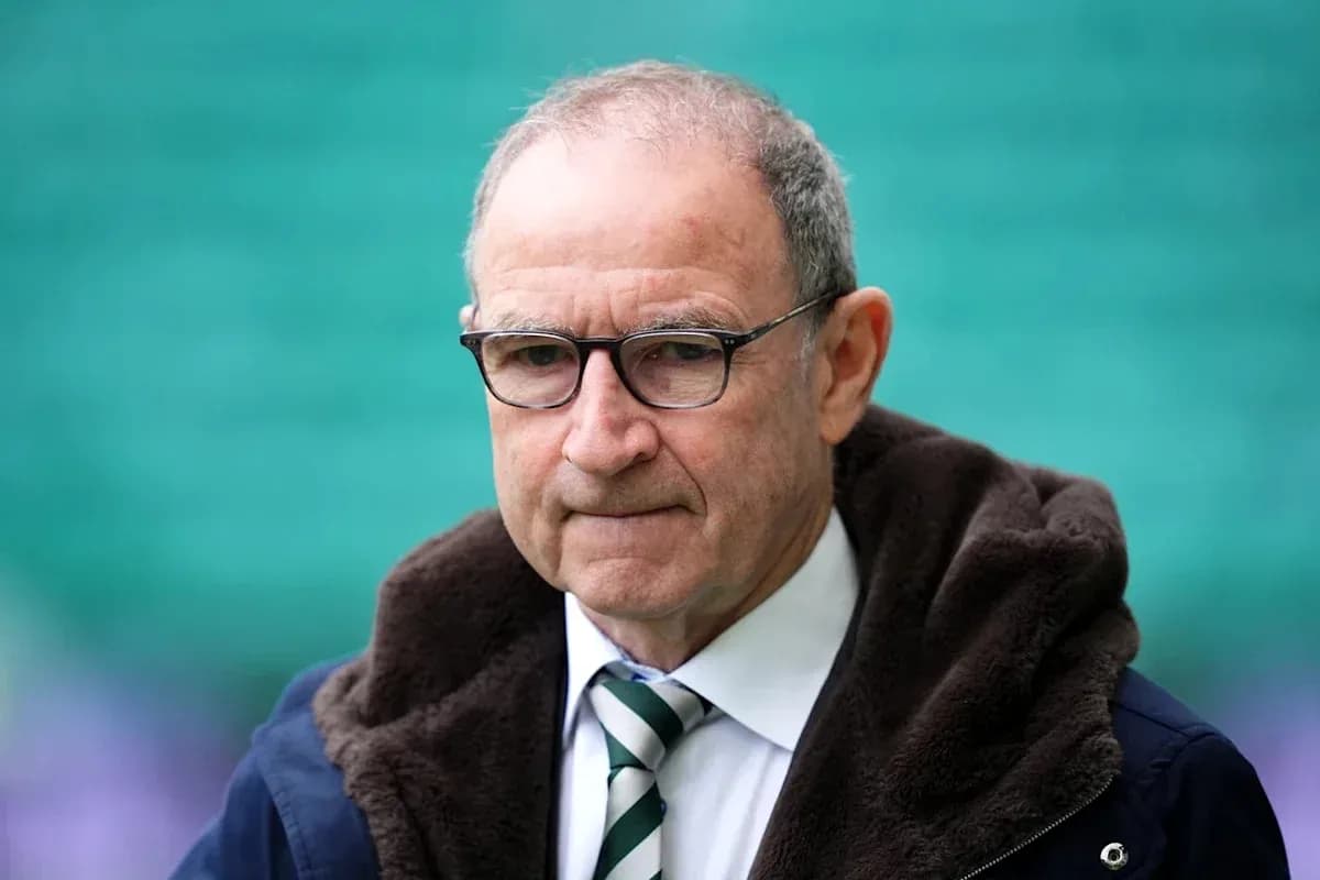 Man in glasses wearing a dark coat and tie Man in glasses wearing a dark coat and tie
