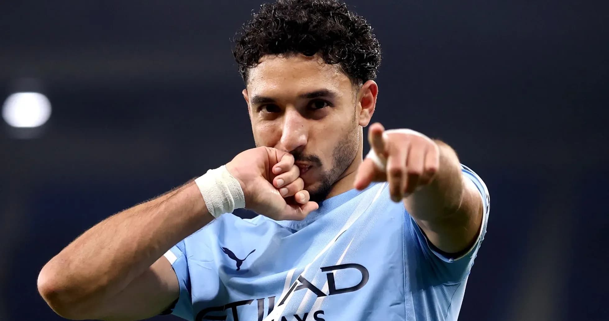 Player celebrating a goal with a gesture Player celebrating a goal with a gesture